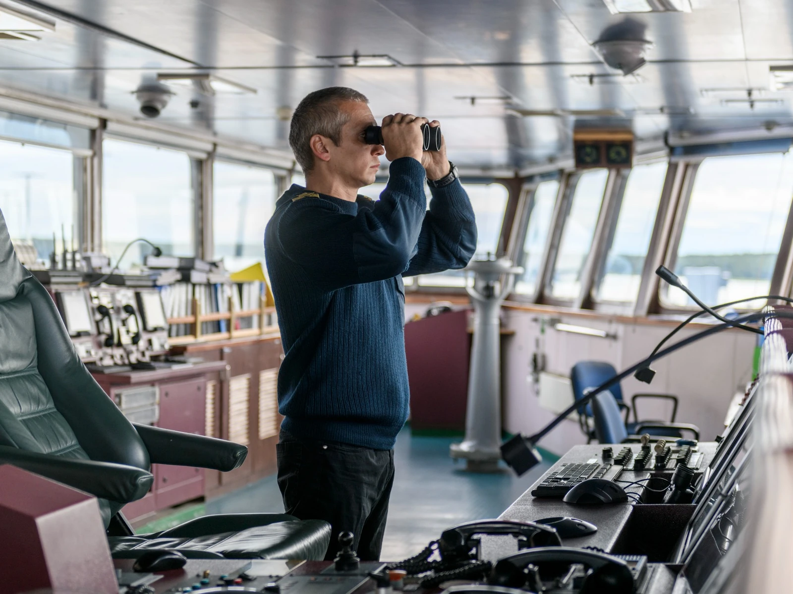 Deck officer on a navigational bridge